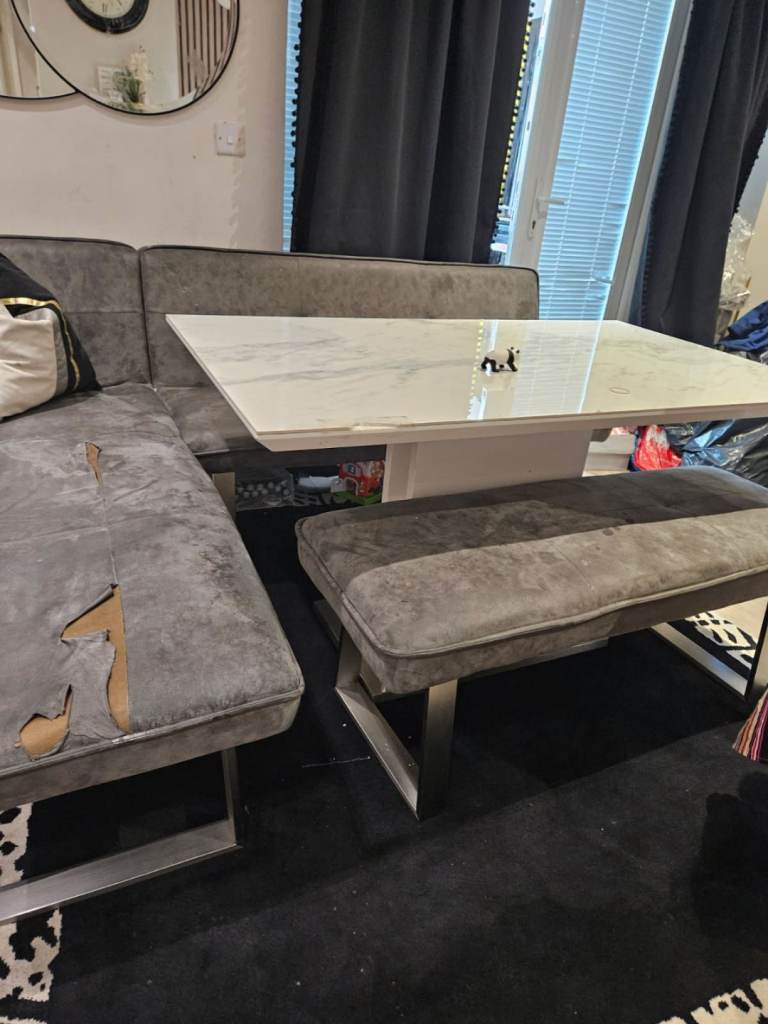 Table with corner chair, sofa and bench