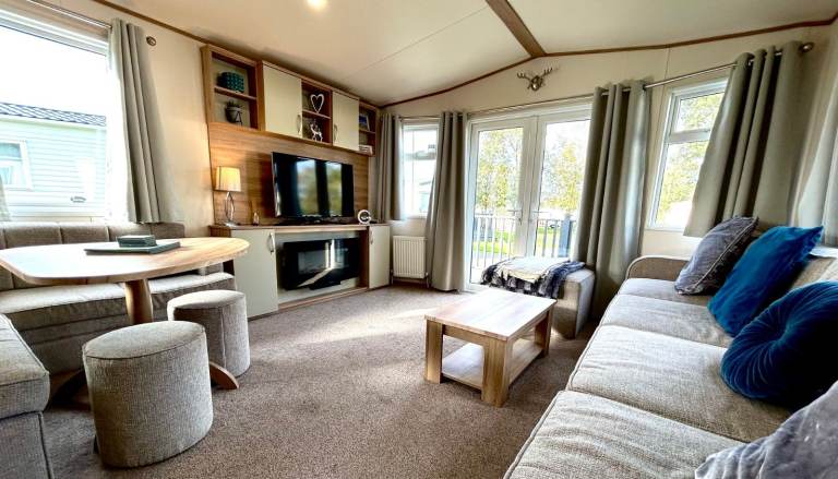 Own a caravan, repaying monthly, near Gt Yarmouth and Lowestoft