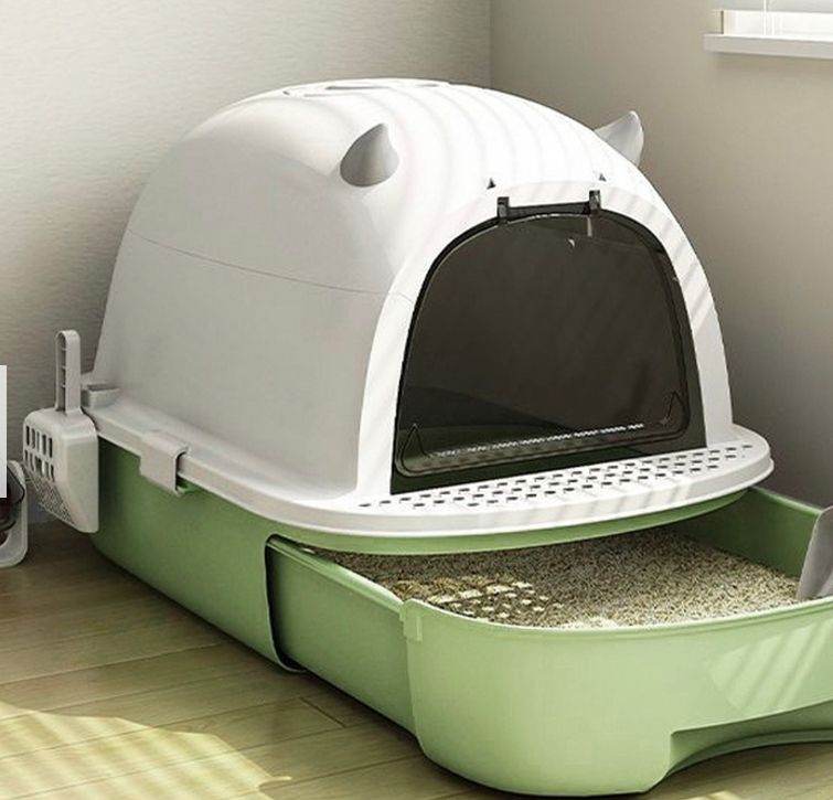 A new still boxed flat packed green x white cat litter box with 