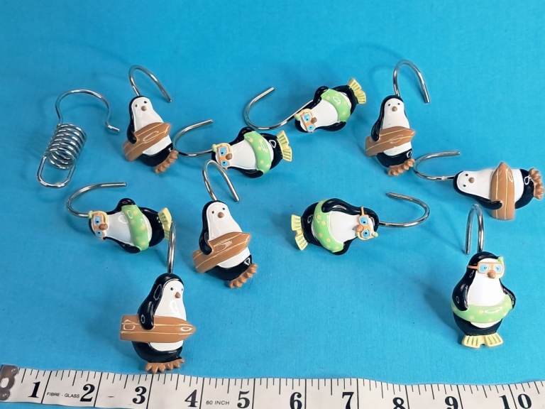 Vintage decorative penguin-themed shower curtain hooks