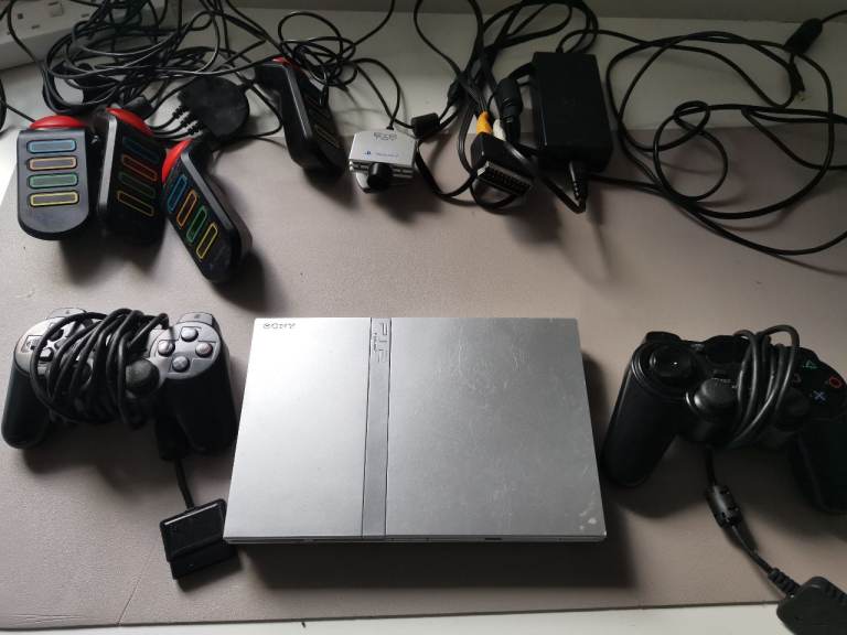 image for PS2 silver slim 2x controllers & game