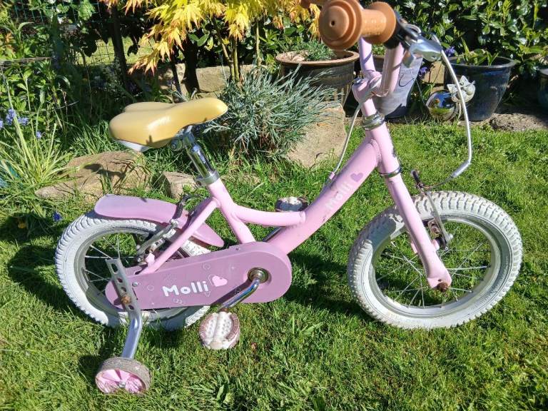 Leeds 15. £25 no offers, thanks.  Raleigh Molli, pink 💗 kids bike with stabilisers 14 inch wheels 