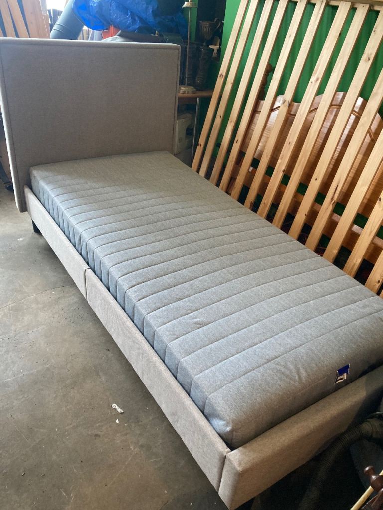 Single grey fabric bed with ikea mattress 