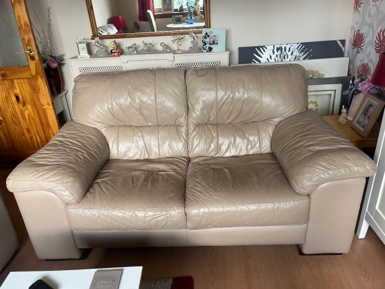 Free to uplift Beige Leather Two-Seater Sofa – Fair Condition
