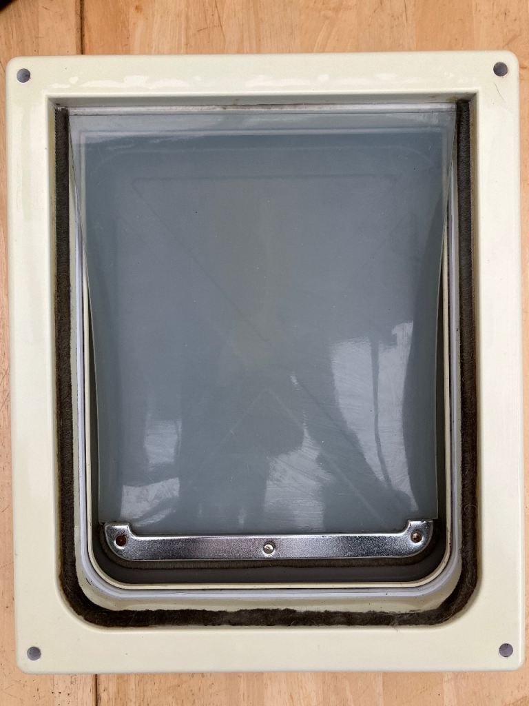 Free medium used cat/dog flap 