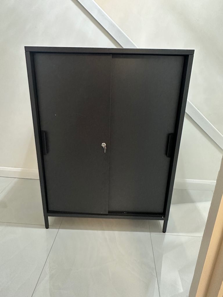 Trotten Cabinet with sliding lockable doors, accessible from both sides £80 