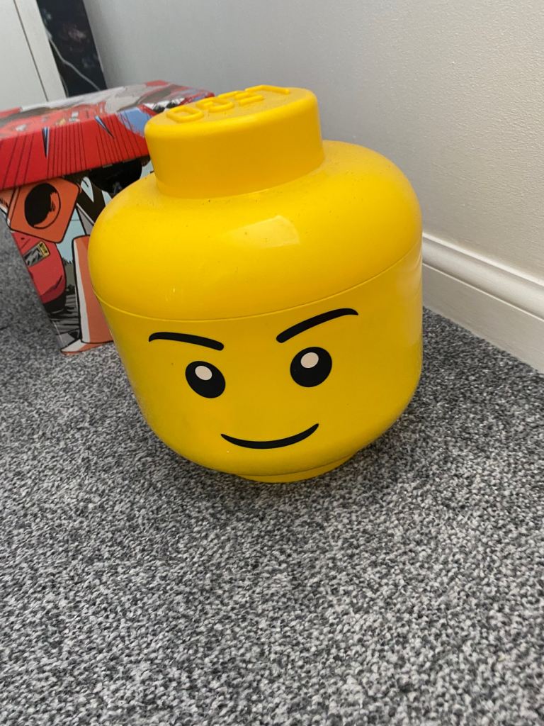Lego head storage with lots of Lego and figures