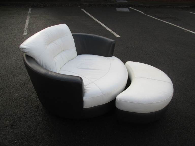 ROUND LEATHER SWIVEL SOFA/CHAIR C/W FOOTREST at HAVEN TRUST CHARITY SHOP