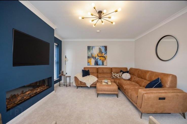 Large corner recliner sofa and footstool