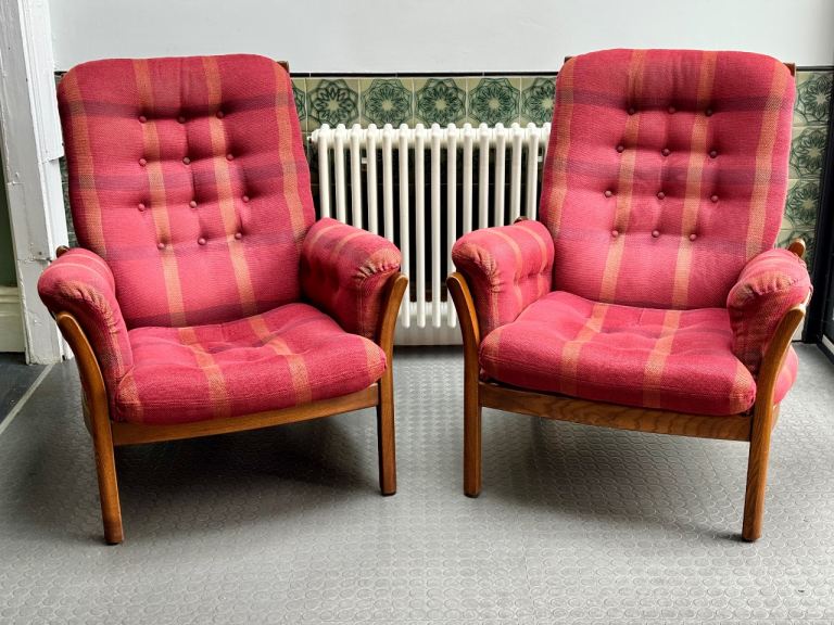 A pair of vintage Ercol Saville chairs