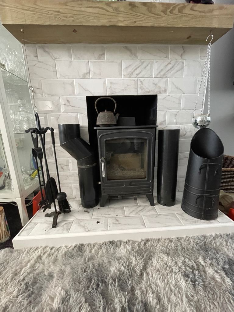 5kw multi fuel cast iron stove plus a couple of pipes and accessories