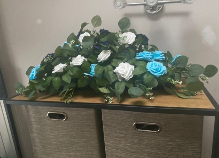 Handmade large flowered top table/wreath L31 x W19 x H11 inches.Message card and holder included 