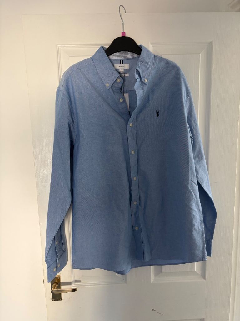 Next blue shirt with label attached