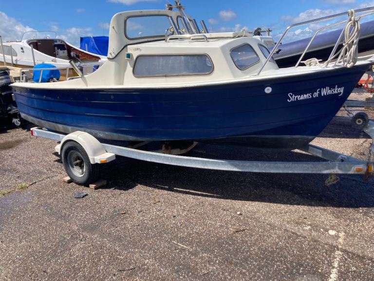 Blue Boat with Trailer – 'Streams of Whiskey', Good Condition