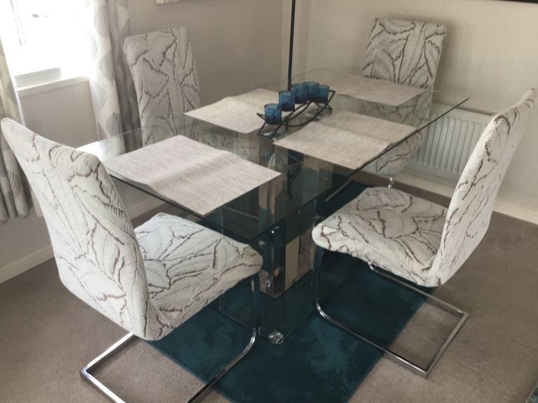 Beautiful dining table complete with chairs.