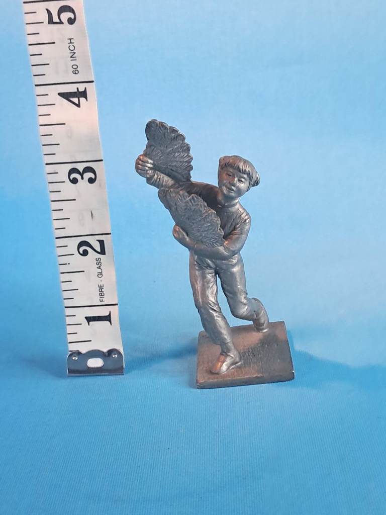 This is a Royal Selangor Chinese fan dancer figurine. 