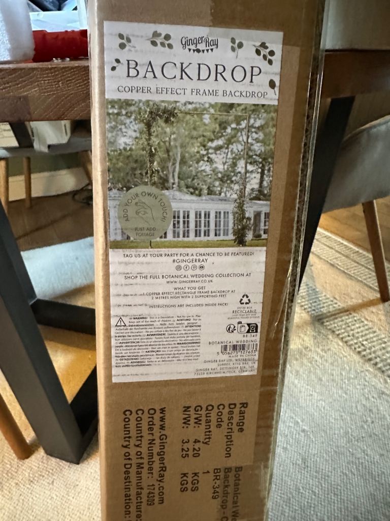 Ginger Ray Wedding arch with wedding fabric backdrop 