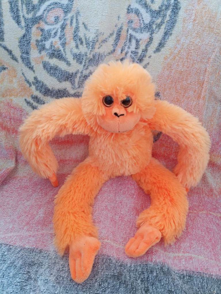 Orange monkey soft toy 