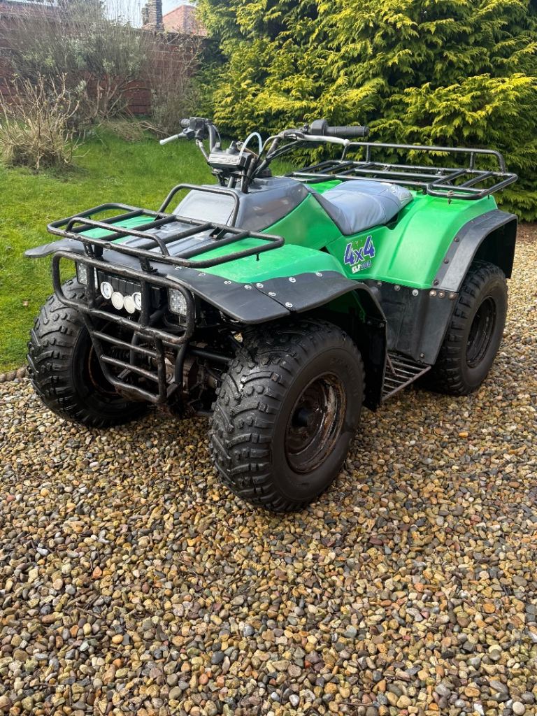 Kawasaki KLF 300 4x4 farm quad with racks