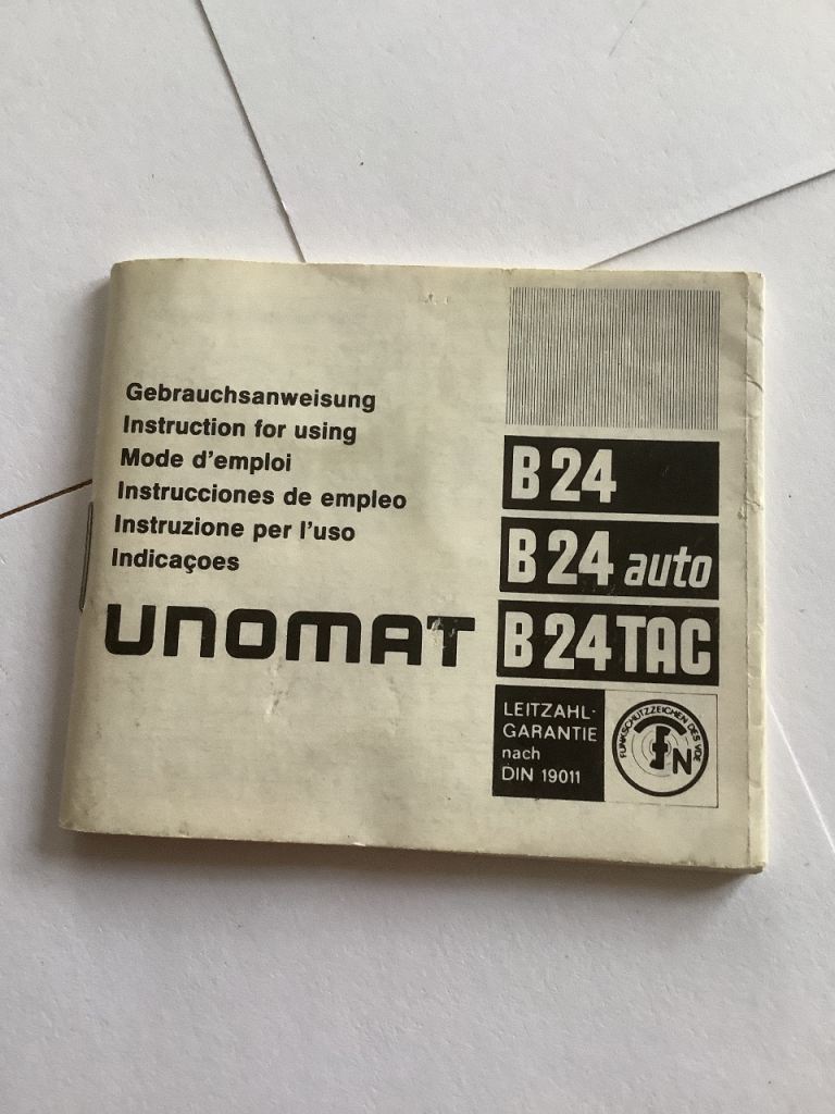 Nikon Nikkormat FT2 Film Camera and Unomat Flashgun and Coloured Filters.