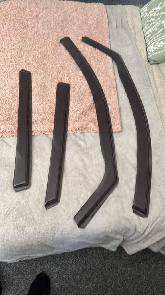 Car window wind deflectors”And Jeep armrest organizer with cup holders and tissue holder.”