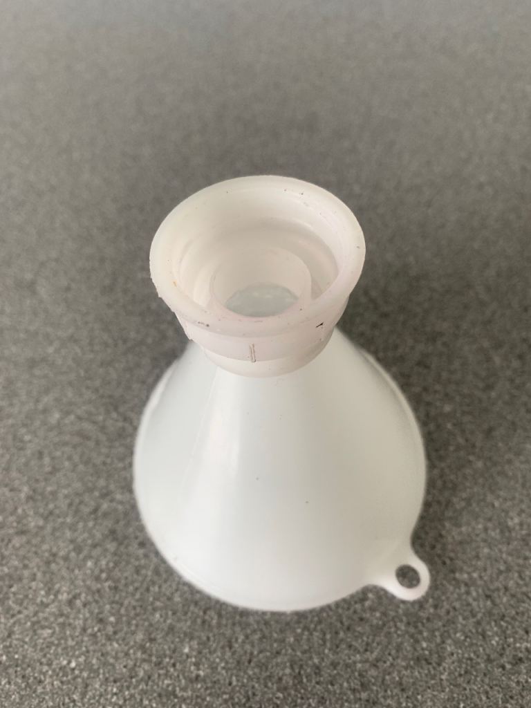 Screw on funnel to fit most spray bottles 