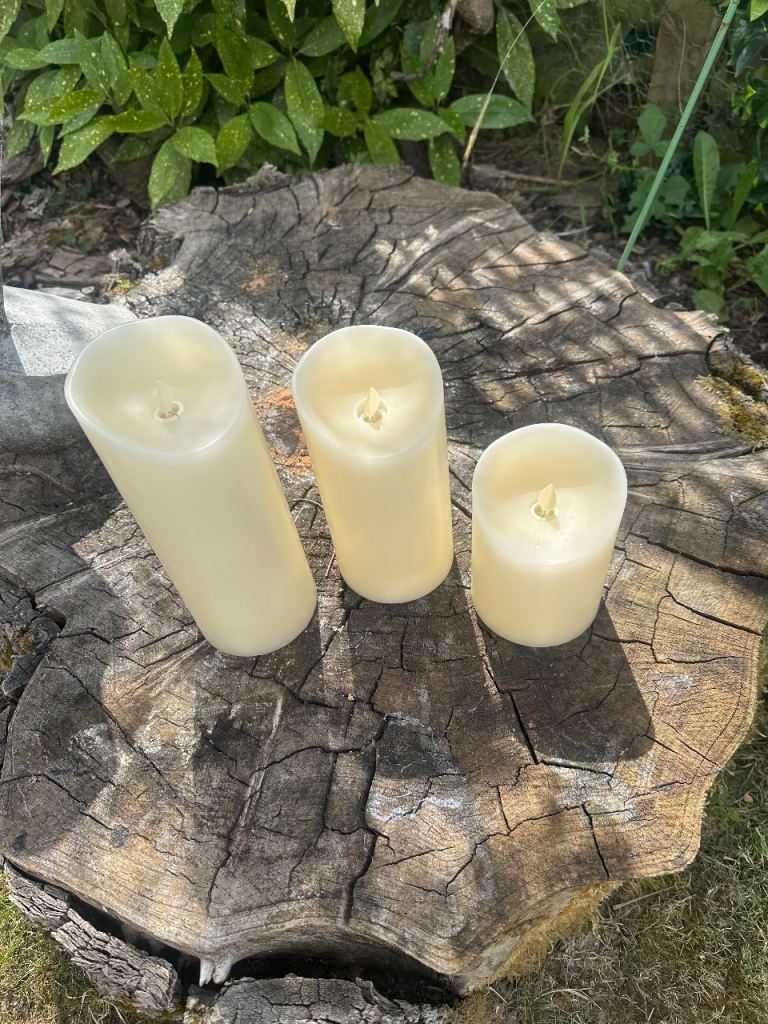 Three Pillar flickering candles on timer.