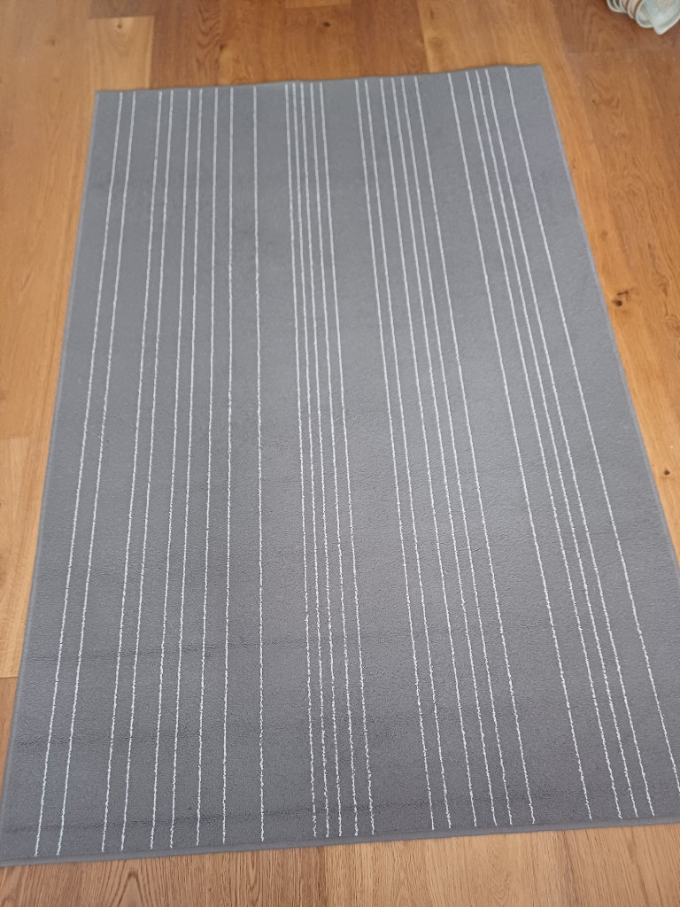 Grey and fine white striped rug