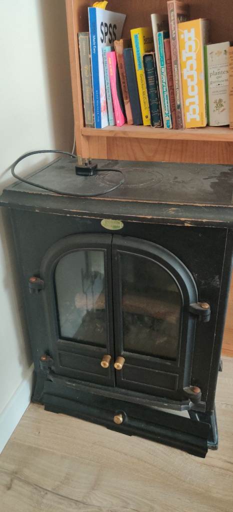 black electric heater, with real coal grill. PICKUP ONLY
