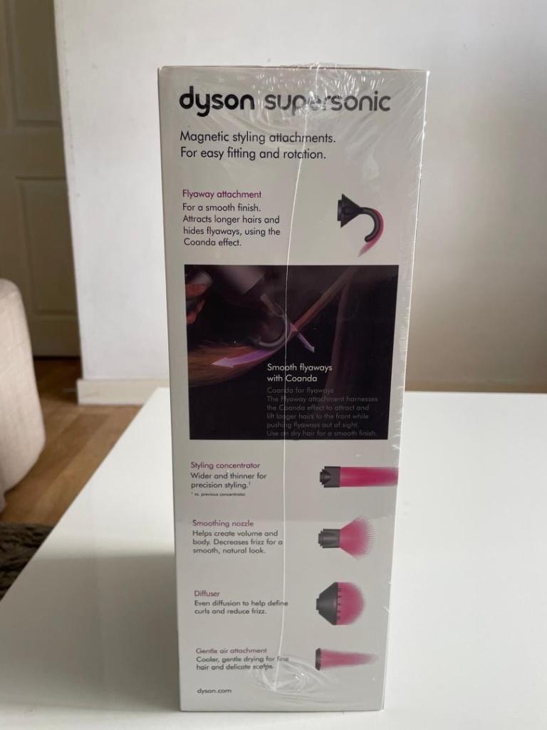 Dyson Supersonic Hairdryer (Model HD08) in a Nickel/Copper finish.
