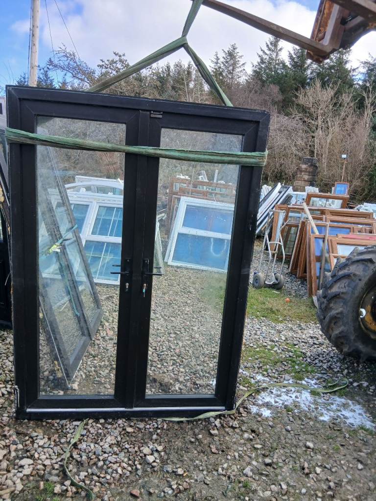 Black pvc patio doors   in wehry good condition 