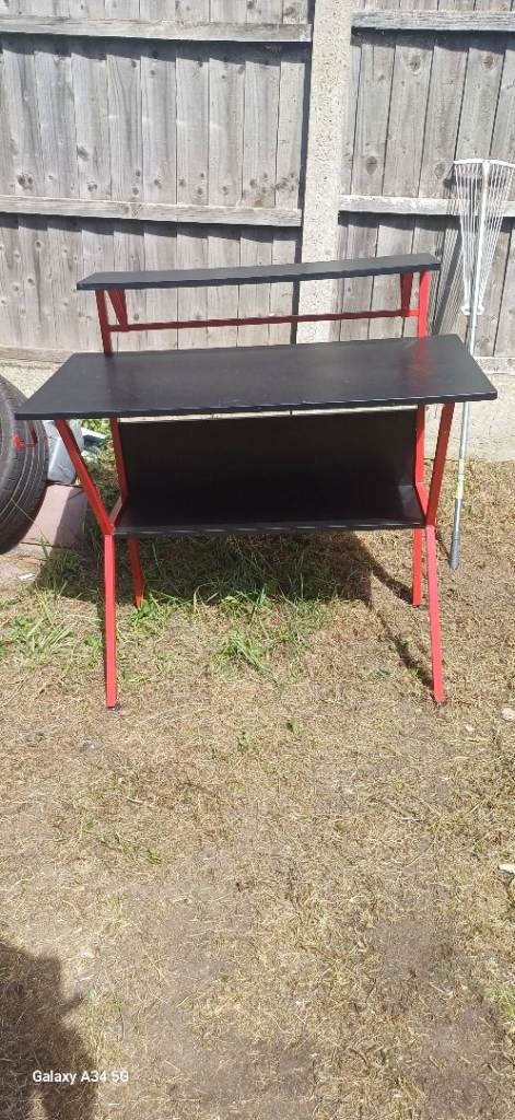 Sturdy Black and Red Desk – Good Condition