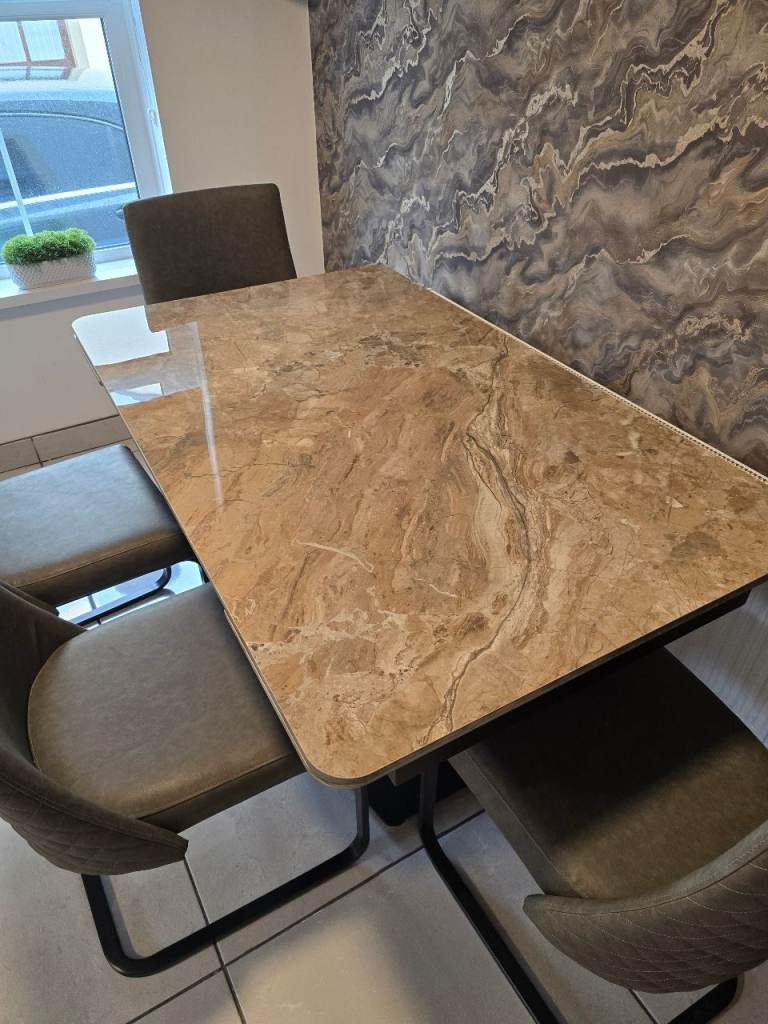 Marble top dining room table, extendable with 4 Grey dining lever back chairs 