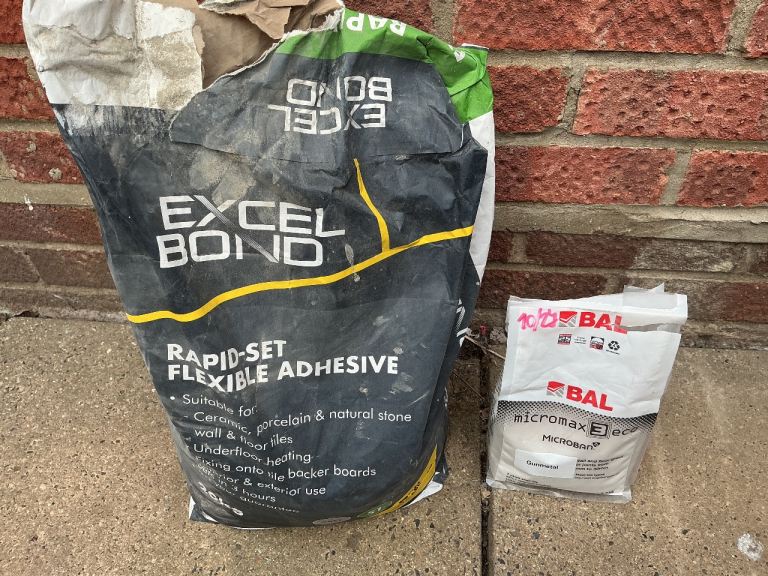 Excel bond adhesive + gunmetal grey grouting mix