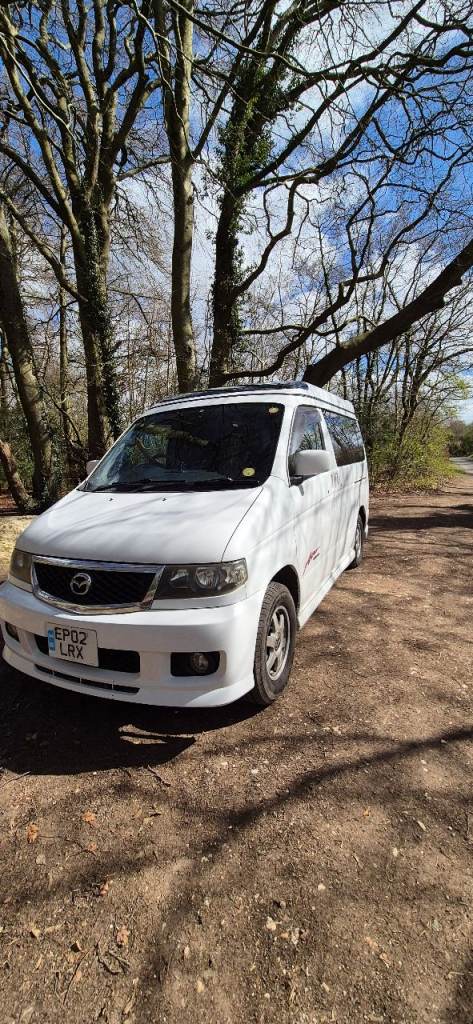Mazda Bongo Friendee 2002, 2.5l V6 Petrol Campervan with side conversion layout.