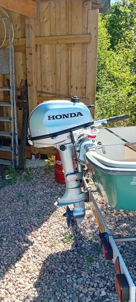 12ft fibreglass boat with 6hp Honda engine (like new) and galvanised indespension trailer (new