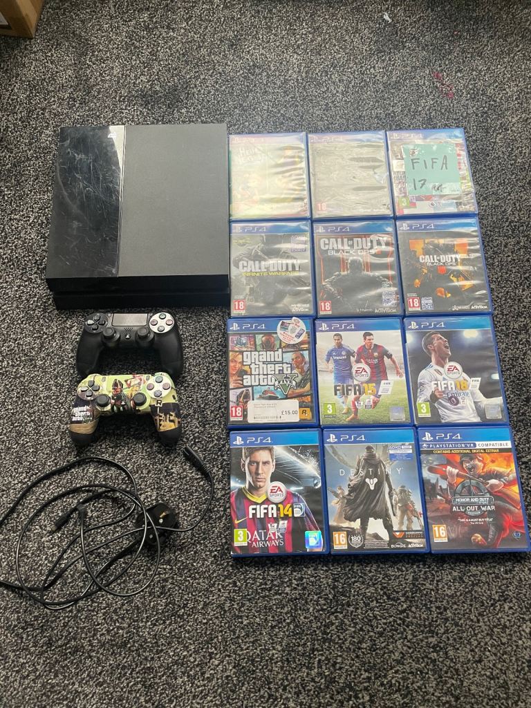 Sony PlayStation 4 500GB Home Console Jet Black with 2 Controllers and 12 Games