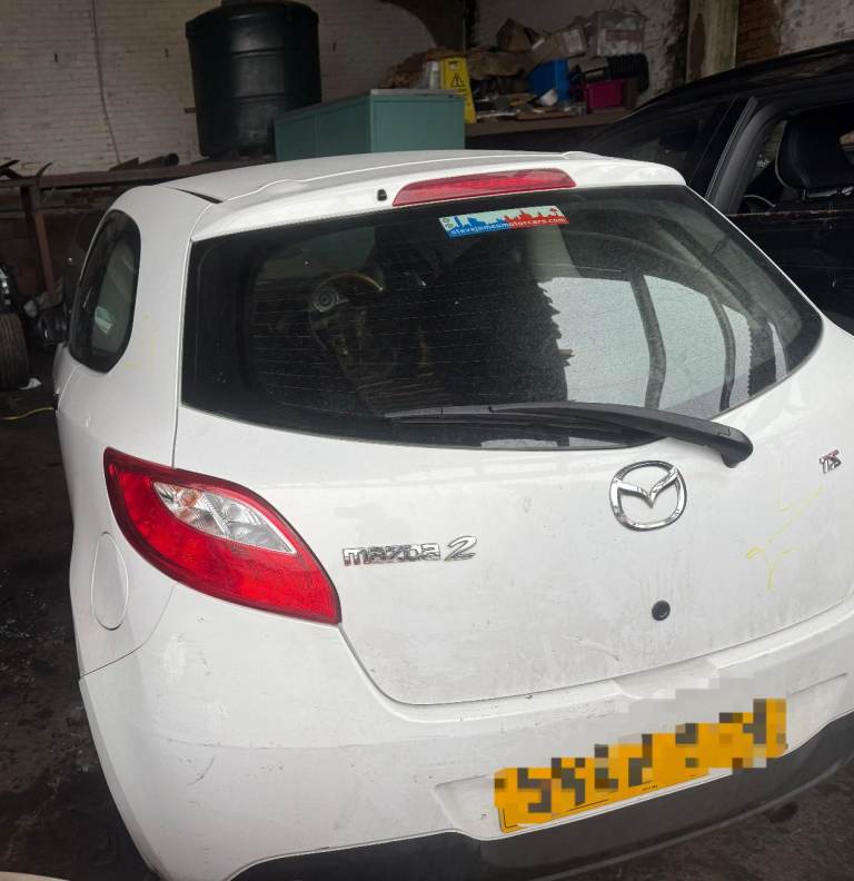 Breaking spare parts mazda 2 white