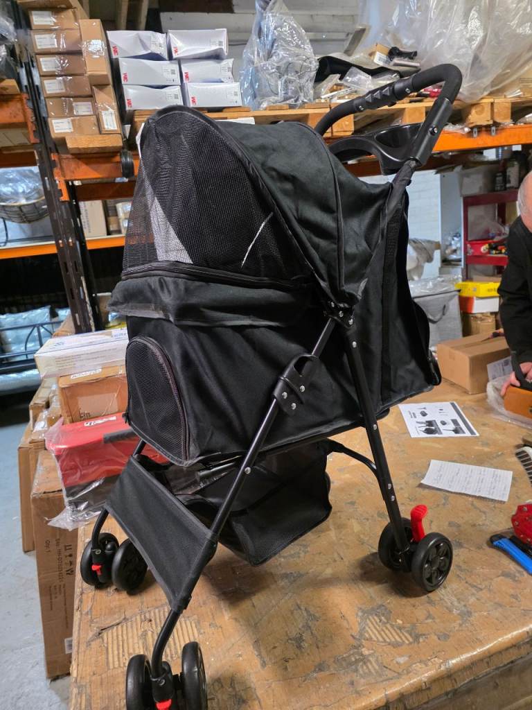 A new already built small dog pushchair.