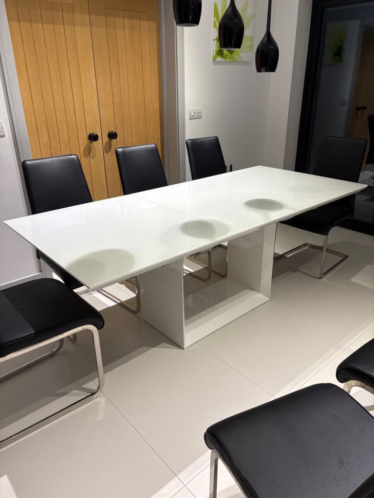 White glass dining table and 6 or 8 chairs