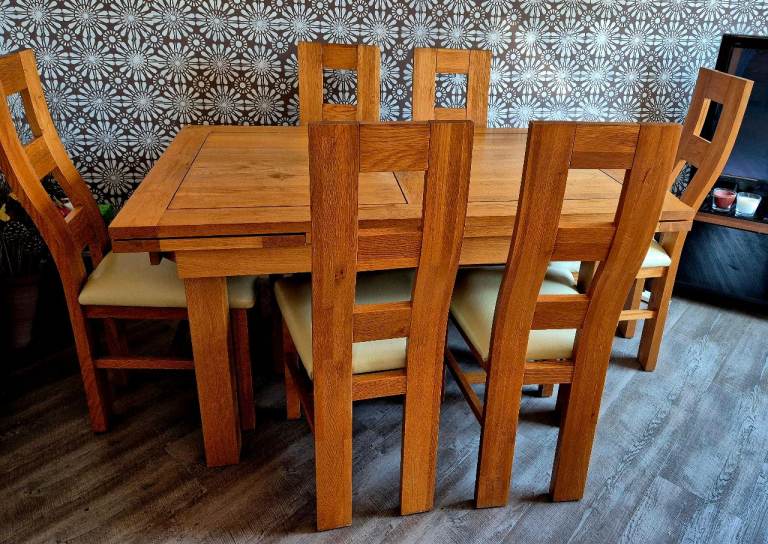 Solid oak dining table and chairs