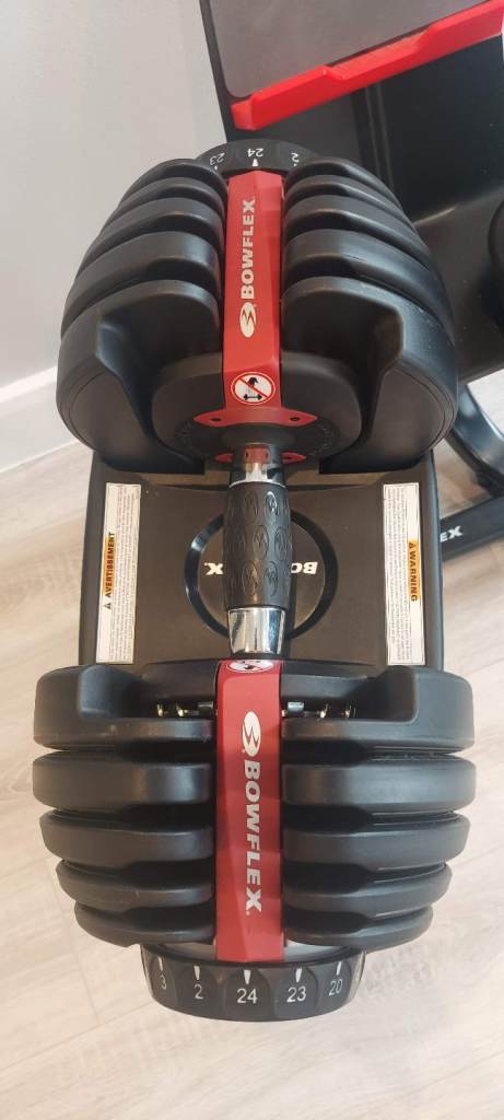 As new Bowflex 552i 2-24kg SelectTech adjustable dumbbells & media stand 