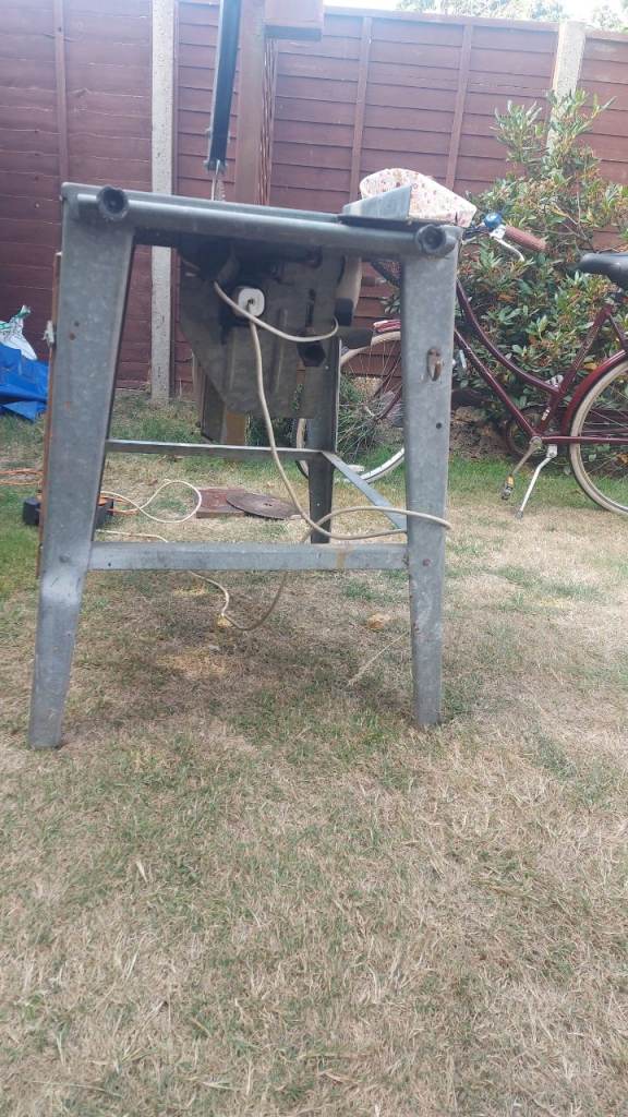 Old Power Saw on Stand – Fair Condition