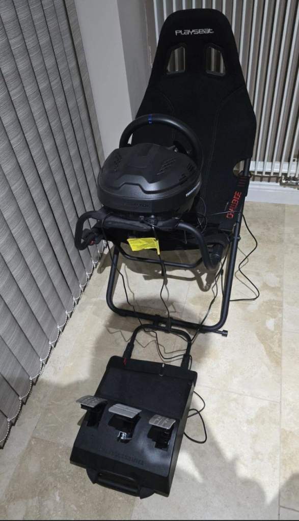 Thrustmaster t300rs with no pedals also includes playseat challenge frame and shifter 