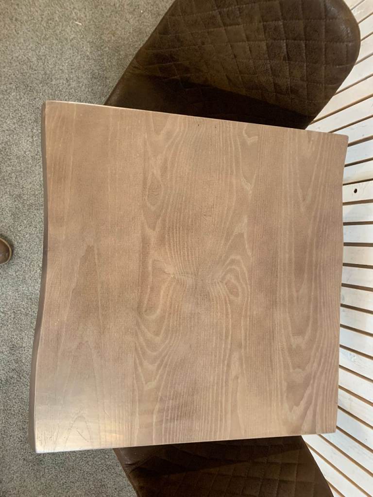 Bistro Dining Table with two Chairs, featuring Square Brown Faux-Suede Seats .