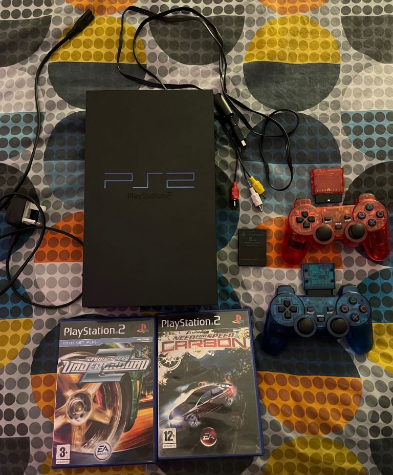 PlayStation 2 with 2 Wireless Controllers & 2 Games