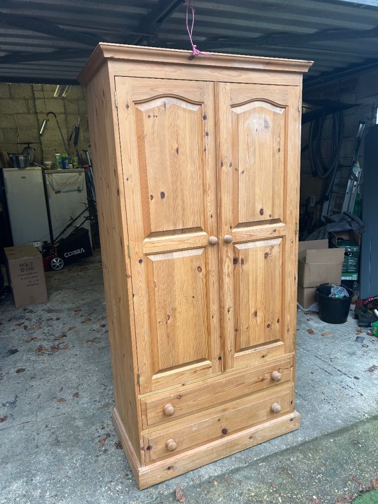 Solid chunky pine wardrobe with 2 drawers. Possible delivery 