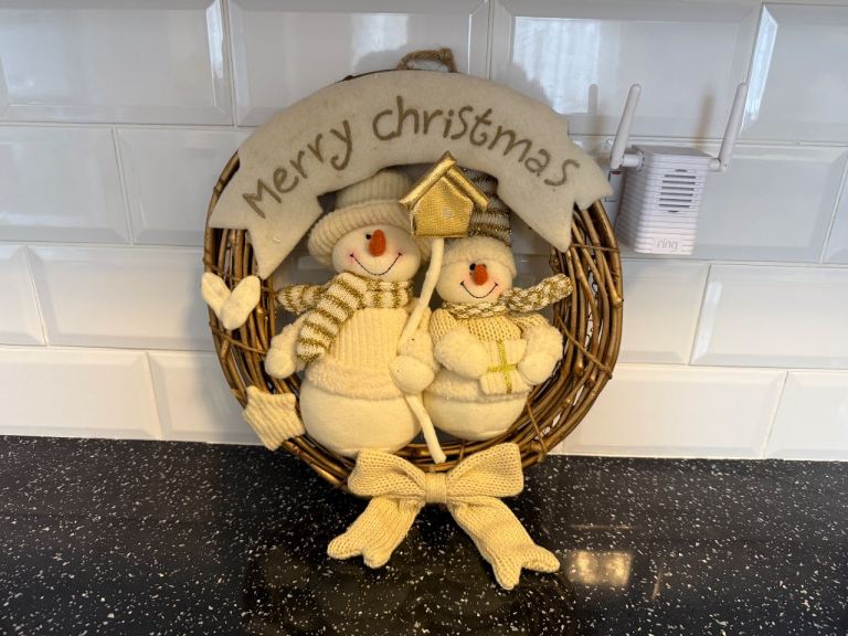 Snowman Christmas wreath featuring 2 plush Snowman figures and a "Merry Christmas" sign 14" approx 