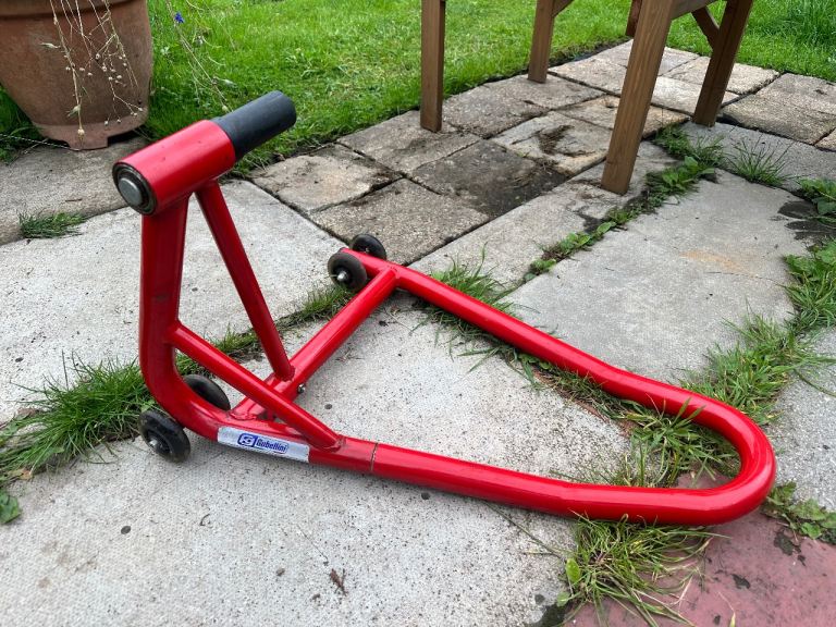 Paddock stand for single sided swingarm