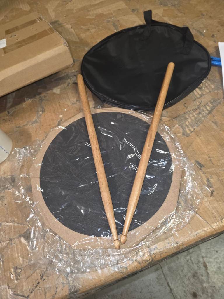 A new practice drum Pad with sticks .